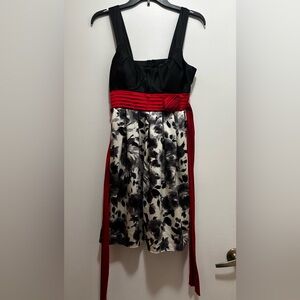 Tri City Knee-Length Dress – Black Floral Print with Red Waist Detai